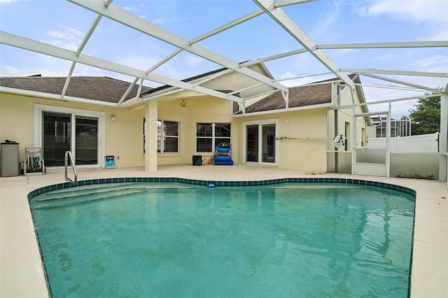 view of pool featuring a lanai, ceiling fan, and a patio