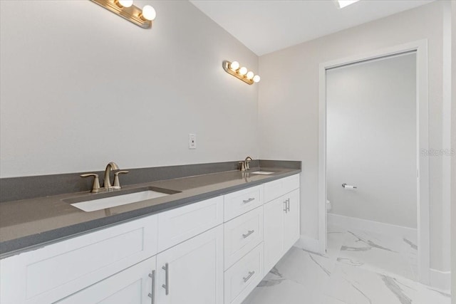 bathroom with tile patterned floors and double vanity