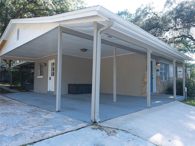 exterior space with a carport