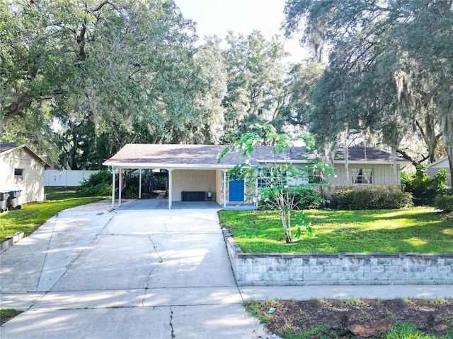 ranch-style house with a front lawn and a carport