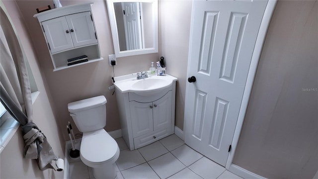 bathroom with vanity, tile patterned floors, and toilet