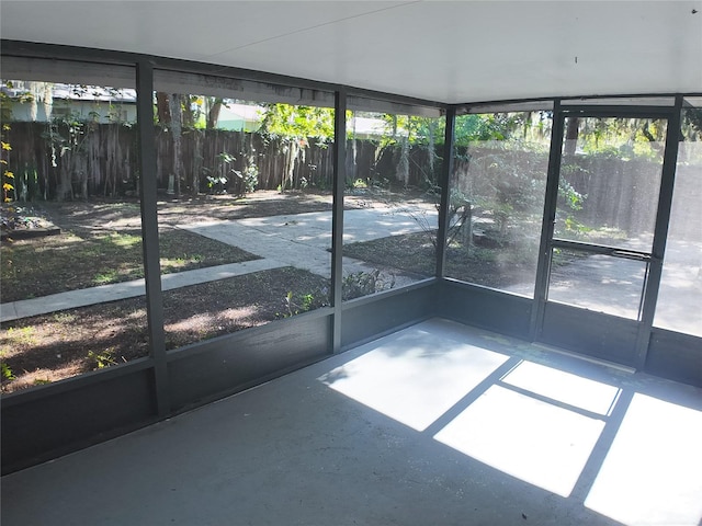 unfurnished sunroom featuring plenty of natural light