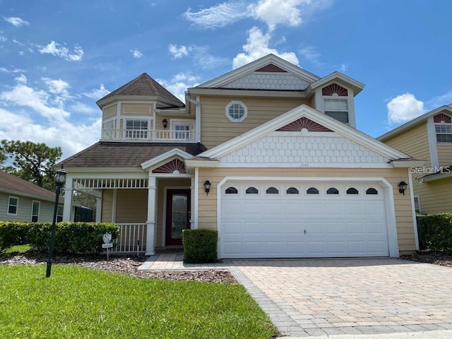 view of front facade with a porch and a garage