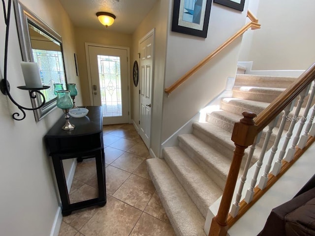 foyer with light tile patterned floors