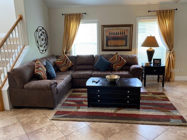 living room with light tile patterned floors and a wealth of natural light