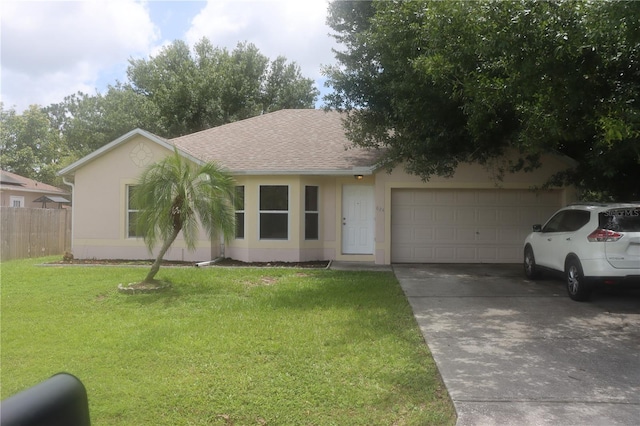 ranch-style house featuring a garage and a front yard