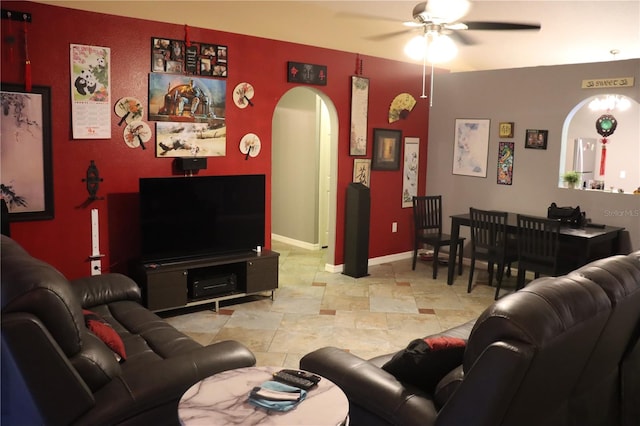 living room featuring tile patterned floors and ceiling fan