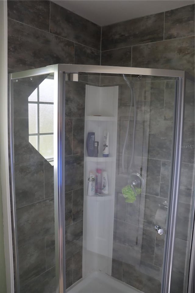 bathroom with an enclosed shower