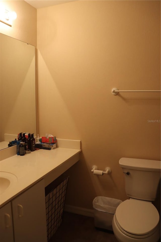 bathroom with vanity and toilet