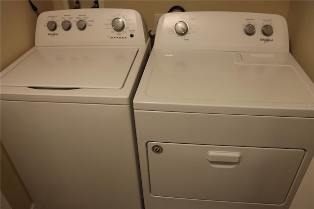 washroom with separate washer and dryer