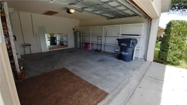 garage featuring gas water heater and a garage door opener