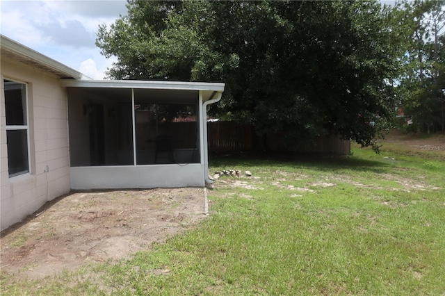 view of yard with a sunroom