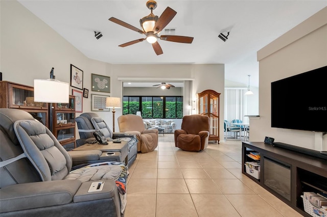 living room with ceiling fan and light tile patterned floors