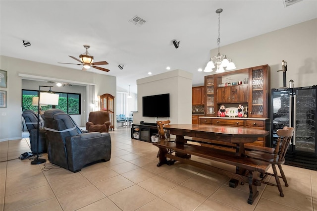 interior space featuring ceiling fan with notable chandelier