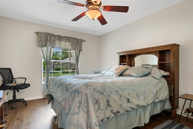 bedroom featuring dark hardwood / wood-style floors and ceiling fan