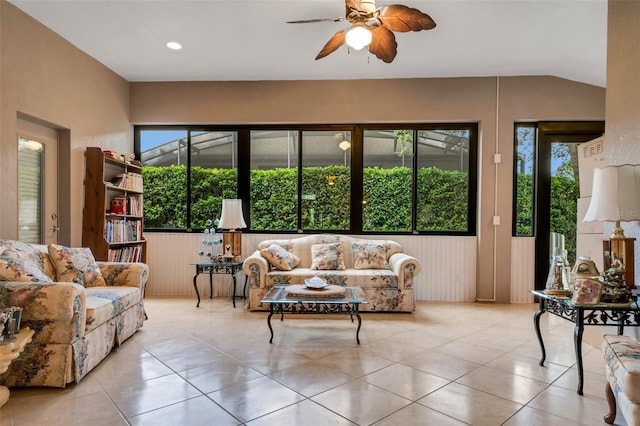 tiled living room featuring ceiling fan