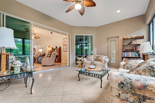 living room with light tile patterned floors and ceiling fan