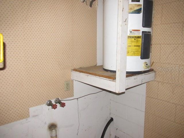 utility room with water heater