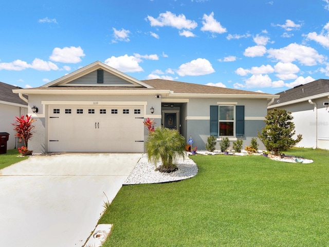 ranch-style home with a front yard and a garage