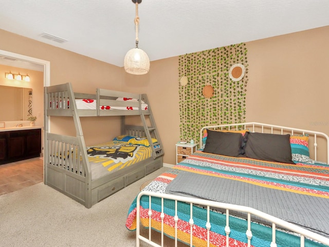 carpeted bedroom featuring connected bathroom