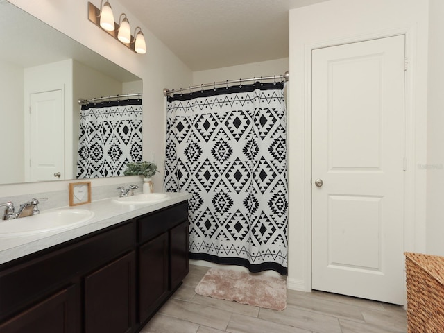 bathroom featuring wood-type flooring and vanity