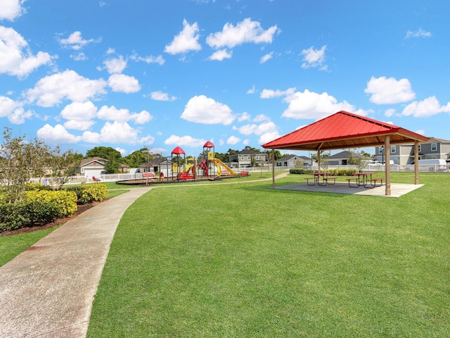 view of community featuring a lawn, a playground, and a gazebo