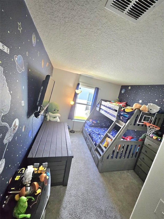 carpeted bedroom with a textured ceiling