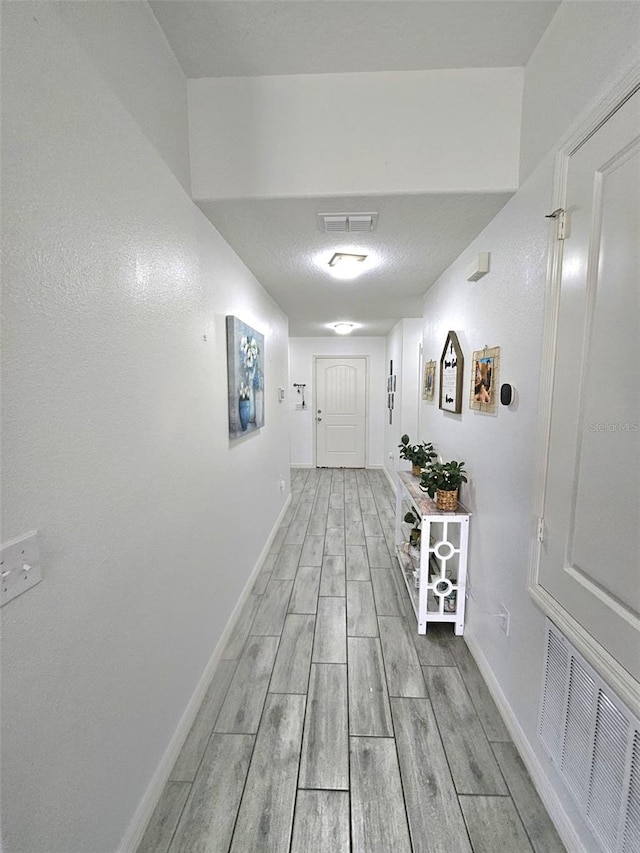 hall featuring light hardwood / wood-style flooring