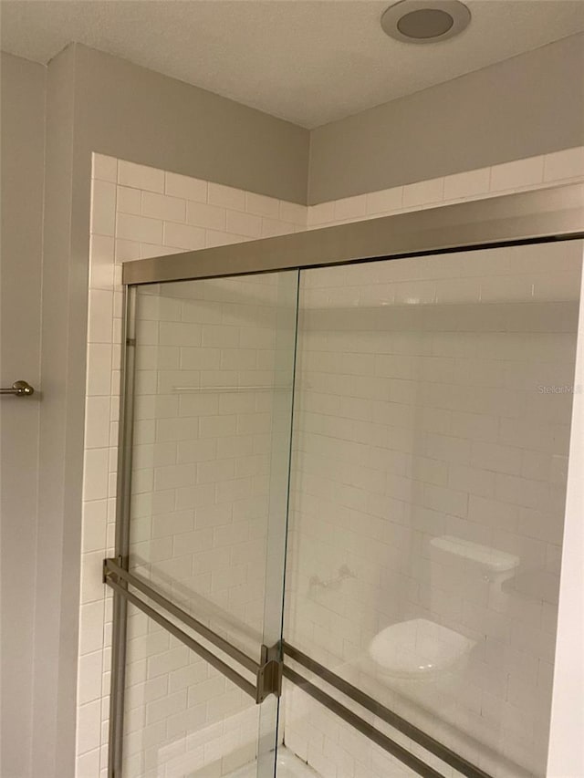 bathroom with an enclosed shower