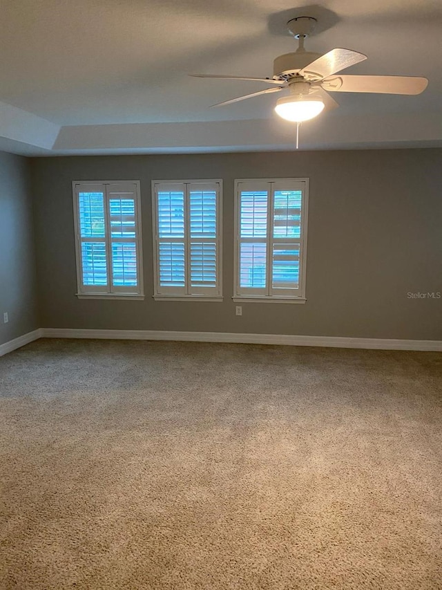 carpeted empty room with ceiling fan