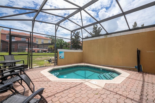 view of pool featuring a lanai and a patio