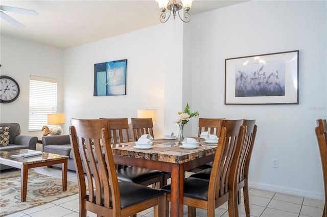 dining area with light tile patterned floors and ceiling fan