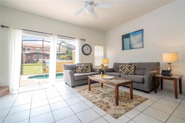 living room featuring ceiling fan and light tile patterned floors