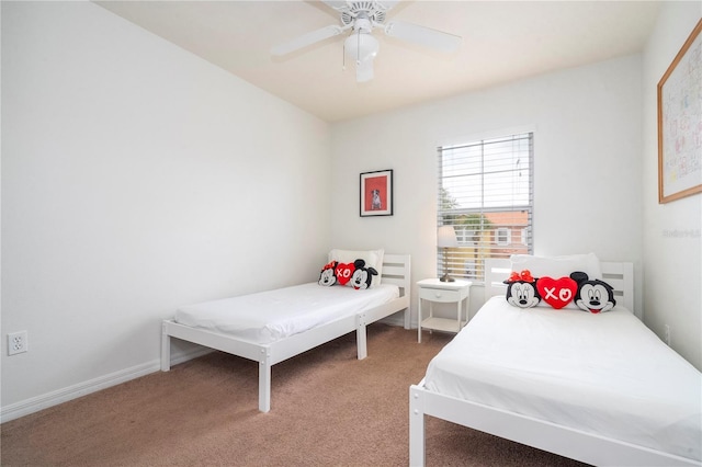 bedroom with ceiling fan and carpet