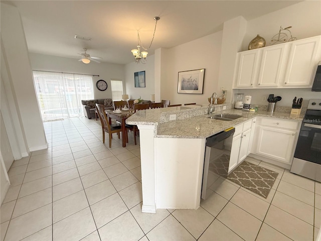 kitchen featuring stainless steel dishwasher, range, kitchen peninsula, and sink