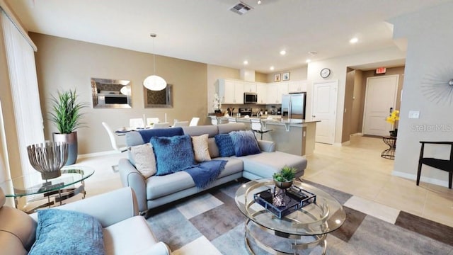 living room with light tile patterned flooring