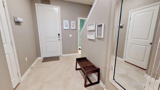 doorway featuring light tile patterned floors