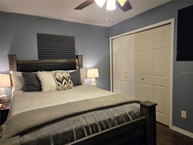 bedroom featuring dark hardwood / wood-style flooring, a closet, and ceiling fan