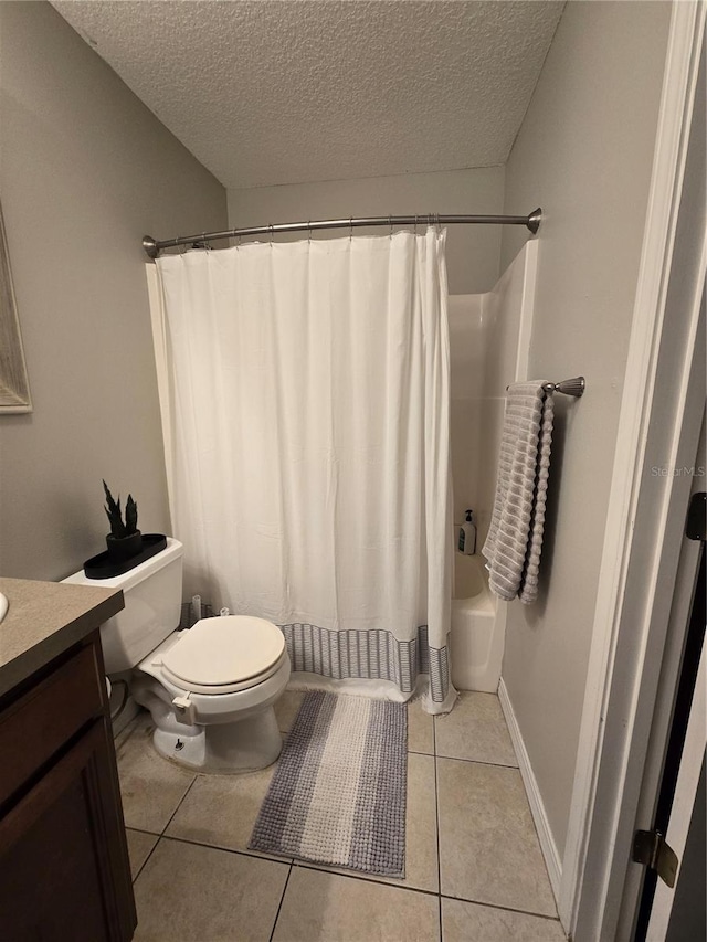 full bathroom with a textured ceiling, toilet, shower / tub combo, tile patterned floors, and vanity