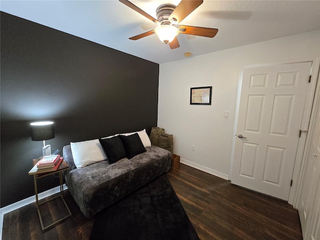 interior space with ceiling fan and dark wood-type flooring