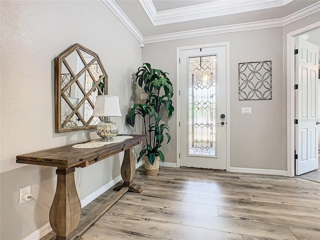 foyer entrance with hardwood / wood-style flooring and ornamental molding