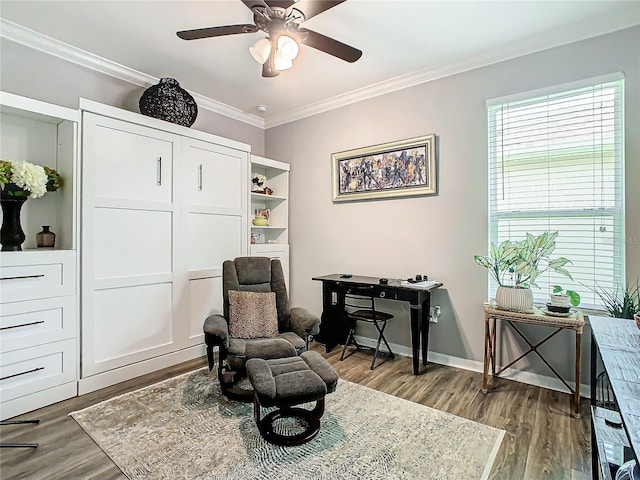 sitting room featuring ceiling fan, hardwood / wood-style floors, and crown molding