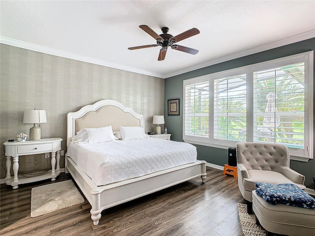 bedroom featuring ornamental molding, ceiling fan, and hardwood / wood-style floors