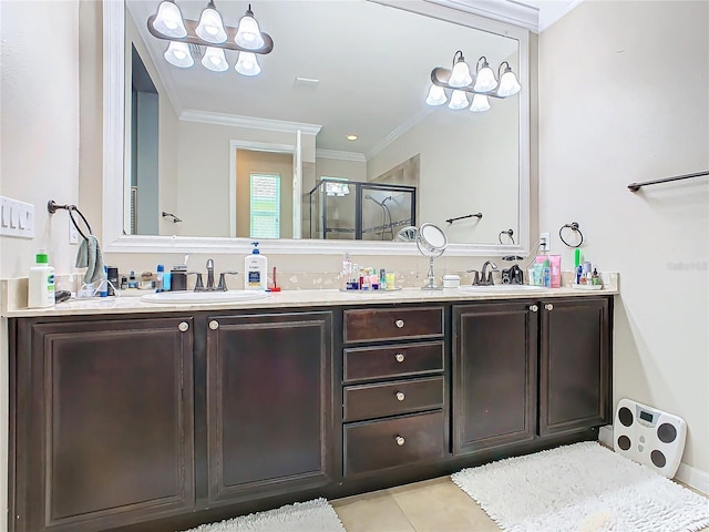 bathroom with vanity, ornamental molding, an enclosed shower, and tile patterned flooring