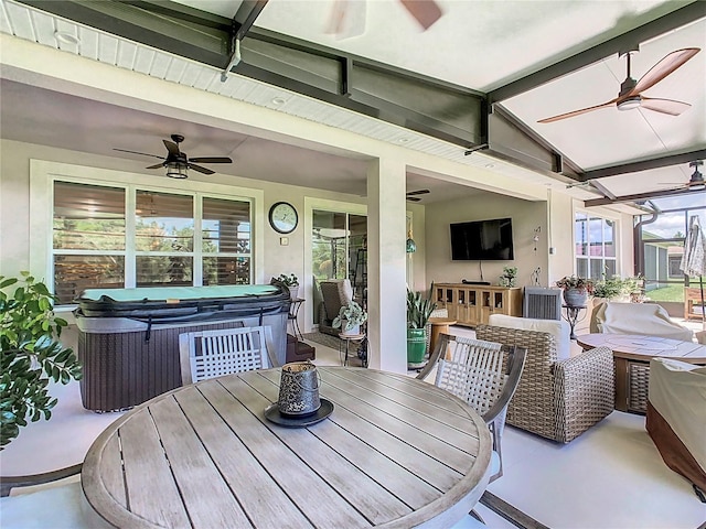 exterior space featuring ceiling fan and a hot tub