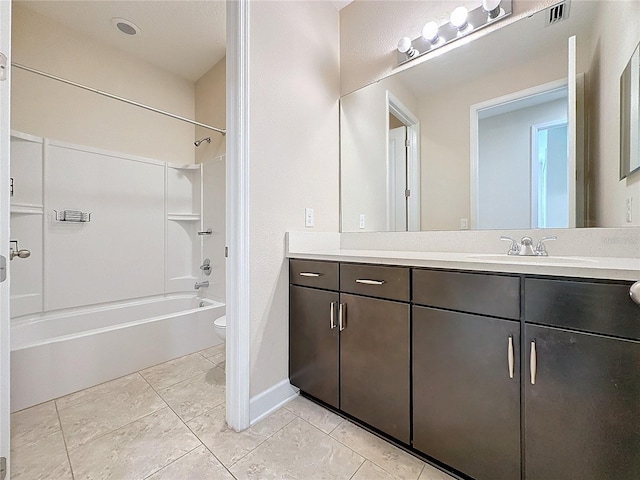 full bathroom featuring toilet, vanity, and washtub / shower combination