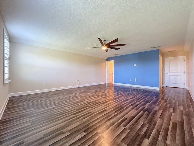 unfurnished living room featuring a textured ceiling, ceiling fan, and dark hardwood / wood-style floors