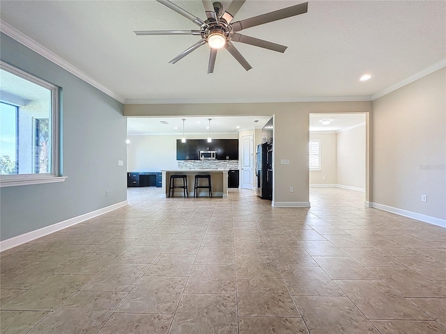 unfurnished living room with ceiling fan, light tile patterned floors, and crown molding