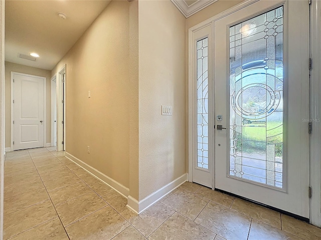 entrance foyer featuring crown molding