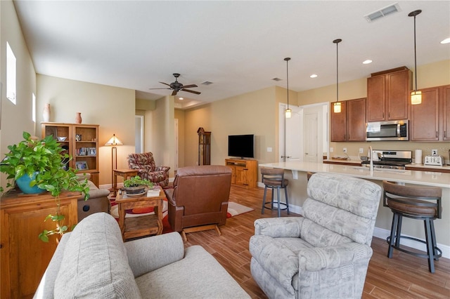 living room featuring ceiling fan